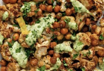 Curry Herb Roasted Cauliflower & Chickpeas w/cilantro lime sauce over sweet potatoes