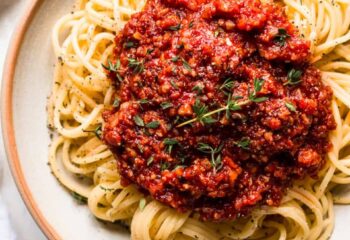 Vegan Spaghetti w/ vegan beef, diced peppers & onion , basil tomato sauce over chickpea pasta