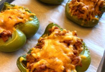 Keto Turkey Stuffed Peppers w/ turkey, spinach, tomato sauce topped with cheddar cheese