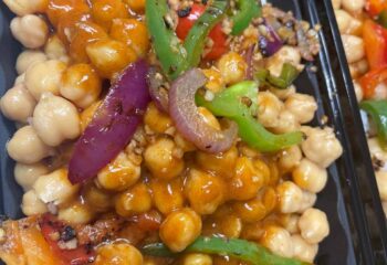 Spicy Chickpeas w/ a tomato curry sauce, peppers, green onion & black sesame seeds
