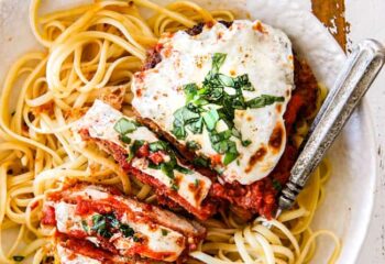 Chicken Parm Grilled w/ cheese, tomato sauce, oregano over linguine noodles & spinach