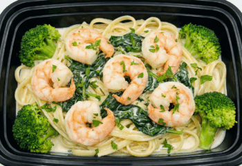 Shrimp Alfredo w/ spinach over linguine noodles, broccoli and alfredo sauce, parsley
