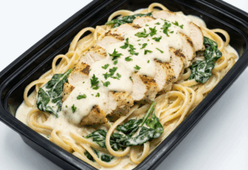 Creamy Chicken Alfredo w/ sauteed spinach and linguine noodles, parsley