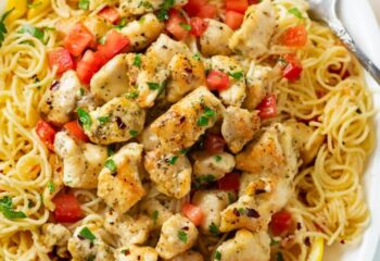 Lemon Chicken scampi over spaghetti squash w/ garlic butter, cherry tomatoes, veg seasoning and spinach