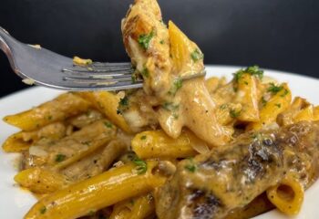 Jerk Chicken Alfredo over creamy penne pasta & broccoli