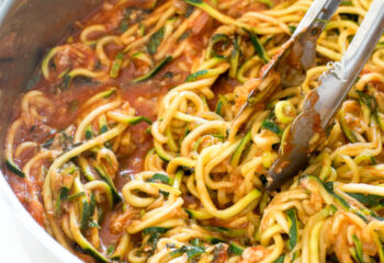 RAW VEGAN- Zucchini noodle spaghetti w/ chopped mushrooms, tomato puree, basil, diced peppers & onion, topped with hemp seeds