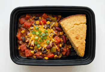 Veggie Chili w/ corn, tomatoes, beans, topped with vegan cheddar and green onion, side of corn bread