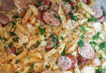Cajun Chicken Penne Pasta w/ alfredo cream sauce, turkey sausage, broccoli, peppers and onion, cajun seasoning, parsley