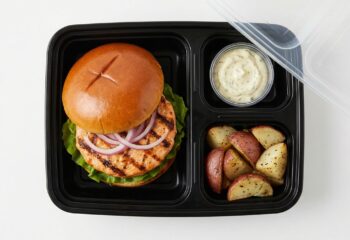 Salmon Burger w/ lettuce, red onion, side of herb mayo, red potatoes