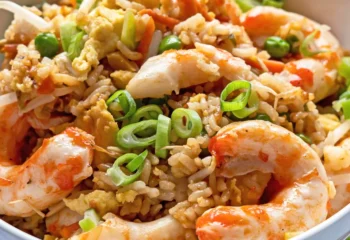 Vegan Crispy Shrimp Fried Rice w/ broccoli, fried rice, diced peppers and onion, green onion, sesame seeds and a side of Thai Chili Vegan Crispy Shrimp Fried Rice w/ broccoli, fried rice, diced peppers and onion, green onion, sesame seeds and a side of Thai Chili