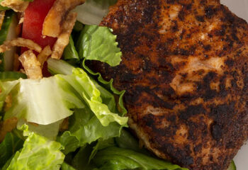 SALAD-Blackened SALMON Salad w/ chopped romaine, spinach, sliced peppers & onion, boiled eggs, ranch, topped with grated parm, lemon wedge SALAD-Blackened SALMON Salad w/ chopped romaine, spinach, sliced peppers & onion, boiled eggs, ranch, topped with grated parm, lemon wedge